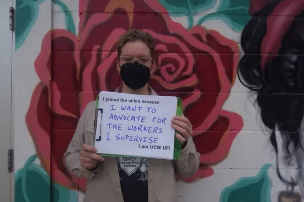 UCWFL member holding a sign